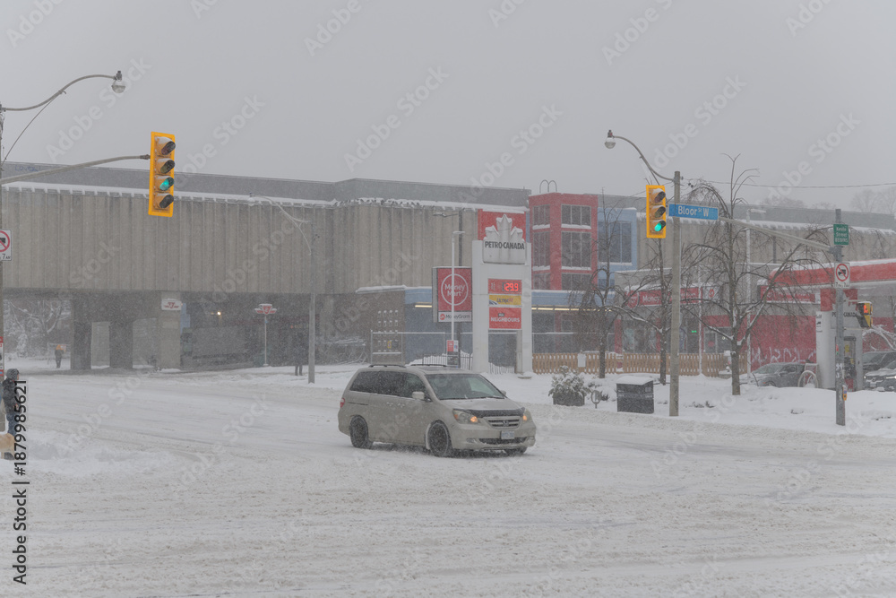 Obraz premium looking northeast to Keele Station of Line 2 from Bloor St W during a snow storm on 2026-01-15 in Toronto