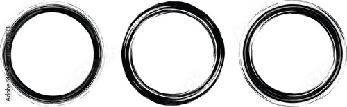 Three metallic rings aligned in a row on a plain surface viewed from directly above in a straightforward manner