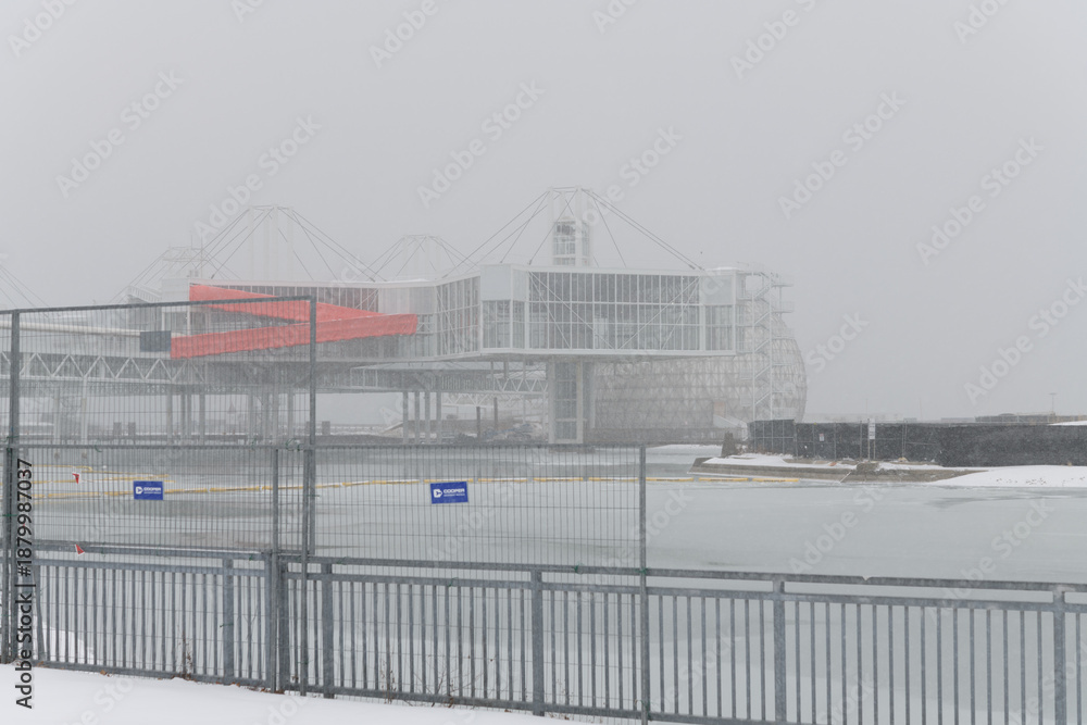 Fototapeta premium wide view of pod pavilions / redevelopment of Ontario Place during a snow storm on 2026-01-15 in Toronto