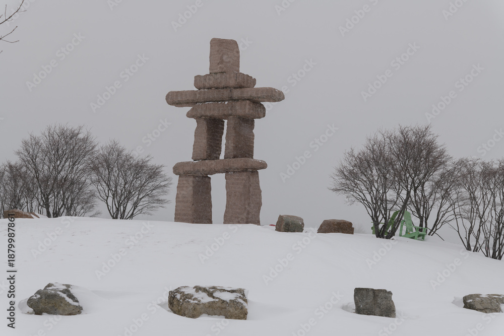 Obraz premium large wayfinding marker at The Toronto Inukshuk Park, 789 Lake Shore Blvd W during a winter storm on 2026-01-15 (north side)