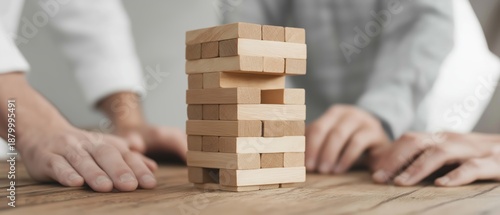 Wallpaper Mural People Engaging in a Strategic Game of Jenga with Blocks on a Wooden Surface Torontodigital.ca