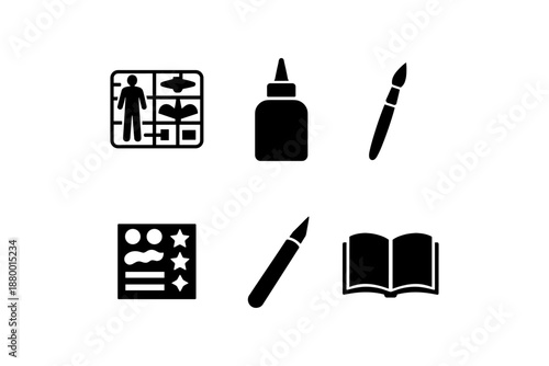 Diy crafting set with glue, paintbrush, knife, and model kit