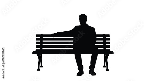 Silhouette of a solitary businessman resting thoughtfully upon a dark park bench