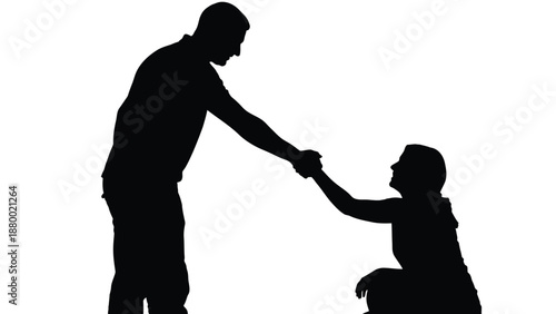Silhouette of a strong man reaching down to help a kneeling woman by offering a hand