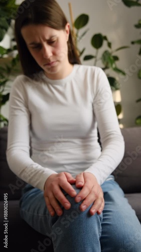 Wallpaper Mural Unhappy sad young caucasian female touching her leg feeling pain in knee joint, and can't walk properly because of inflammation and pain. Arthritis chronic disease problem concept Torontodigital.ca