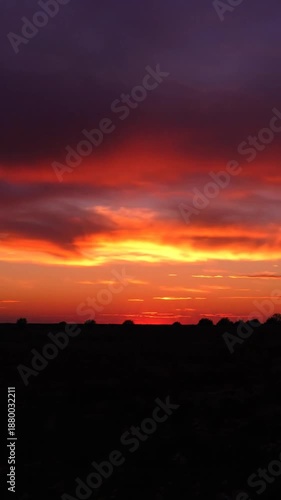 Wallpaper Mural Dramatic sunset sky with vibrant colors over a dark landscape silhouette Torontodigital.ca