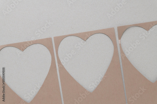 plain brown paper frames with heart shape cutouts