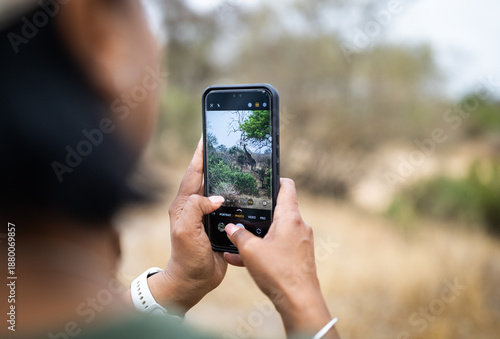 woman holding a mobile phone