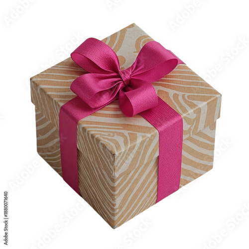 Gift Wrapped in Shiny Paper With a Ribbon Placed on a Plain Background