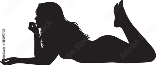 Silhouette of a Young Woman Lying on Her Stomach and Relaxing