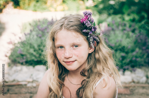 portrait of teenage girl with flowers in hair