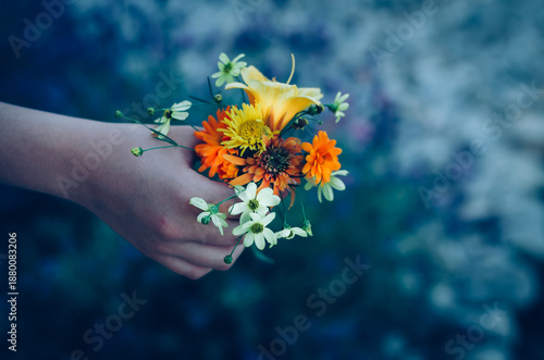 hand with flowers, colorful image