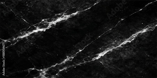 Abstract texture of white water drops splashing over a dark surface creates a powerful nature landscape reminiscent of ocean waves and sea foam on a black and white background