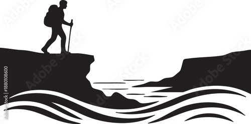 Silhouette of a Hiker Standing on a Cliff Edge Over Water