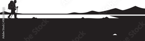 Silhouette of a hiker with a backpack and trekking poles on a mountain trail