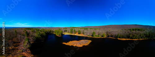 Εκτύπωση καμβά Vibrant Autumn Day Over a Forest Lake