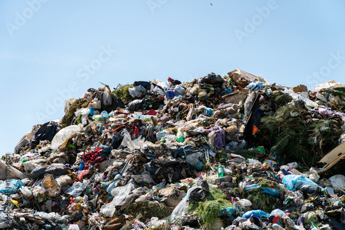 Fotografi Large mound of garbage and waste at a landfill showing various items and materia