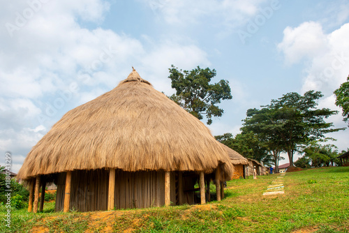 large thatched-roofed hut, emblematic of traditional chiefdoms in Cameroon.