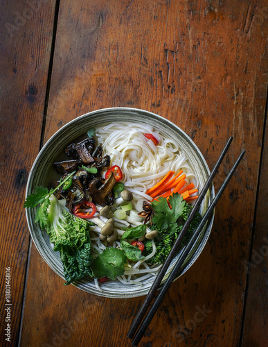 Vegetarian Pho Noodle Soup with Mushrooms, Vegetables, and Chopsticks