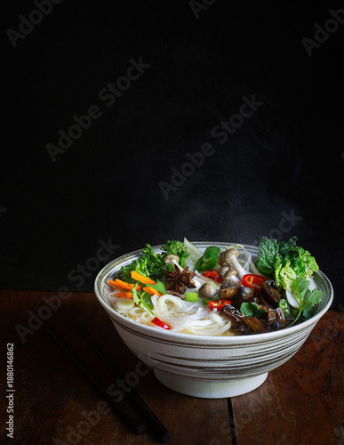 Vegetarian Pho Noodle Soup in Bowl on Dark Background