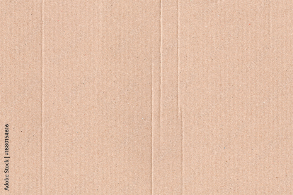 Fototapeta premium Natural brown kraft paper texture background with subtle horizontal grain and recycled fiber details. Minimal cardboard surface ideal for packaging design, eco branding, stationery, mockups, posters.