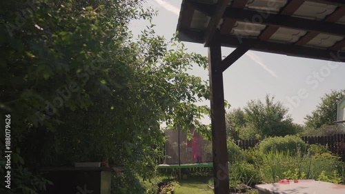 Wallpaper Mural Garden Patio Retreat, Relaxing Outdoor Garden Space, Peaceful Garden Area Beneath Pergola With Lush Greenery, Quiet Outdoor Veranda Overlooking Vibrant Green Garden With Wooden Supports Torontodigital.ca