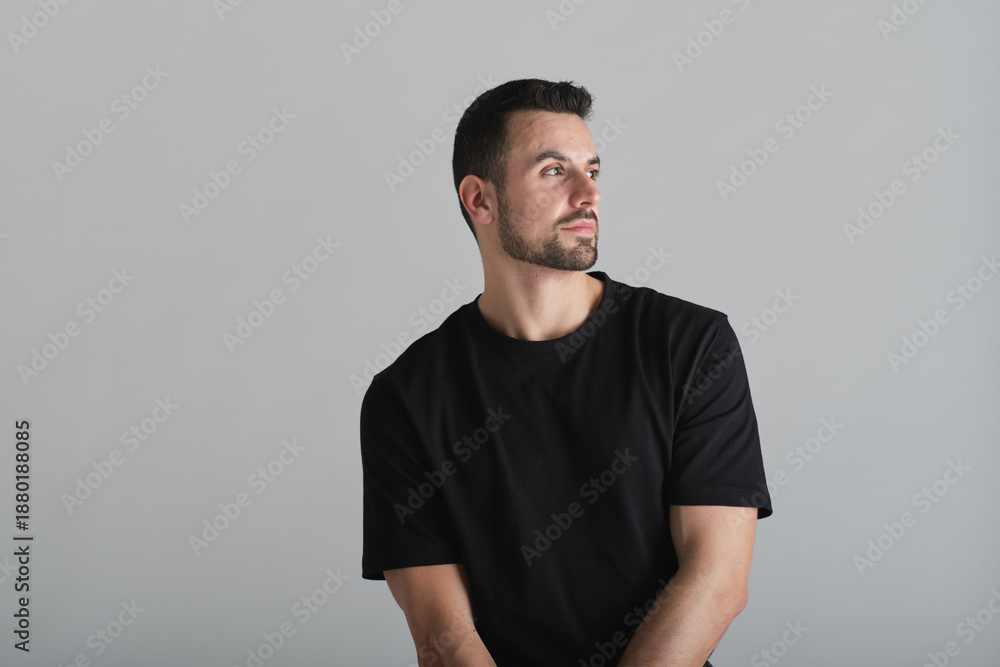 Fototapeta premium Young man looking away contemplating new ideas