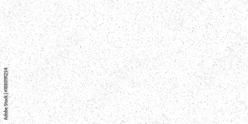 Minimalist speckled background featuring a dense scattering of small grey dots on a bright white canvas for graphic design