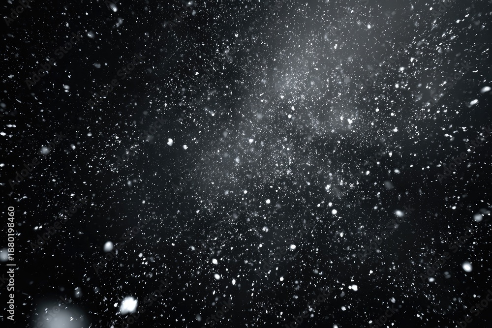 Obraz premium Black background with sparkling particles floating, simulating snow or stardust