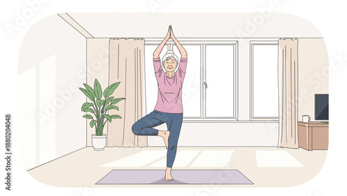 An active senior woman with gray hair practicing the yoga tree pose on a mat in her bright, sunlit living room, embracing a healthy lifestyle.