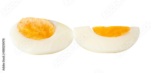 A stack of unpeeled cooked or boiled chicken egg with egg yolk in half and quarter isolated with clipping path in png file format