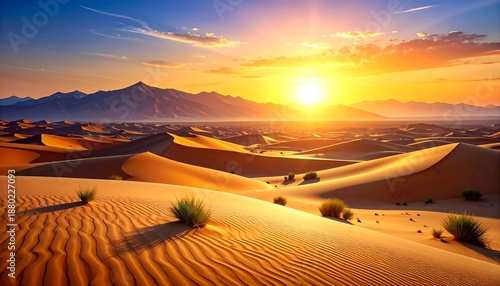 Golden Desert Dunes at Sunset with Distant Mountains.