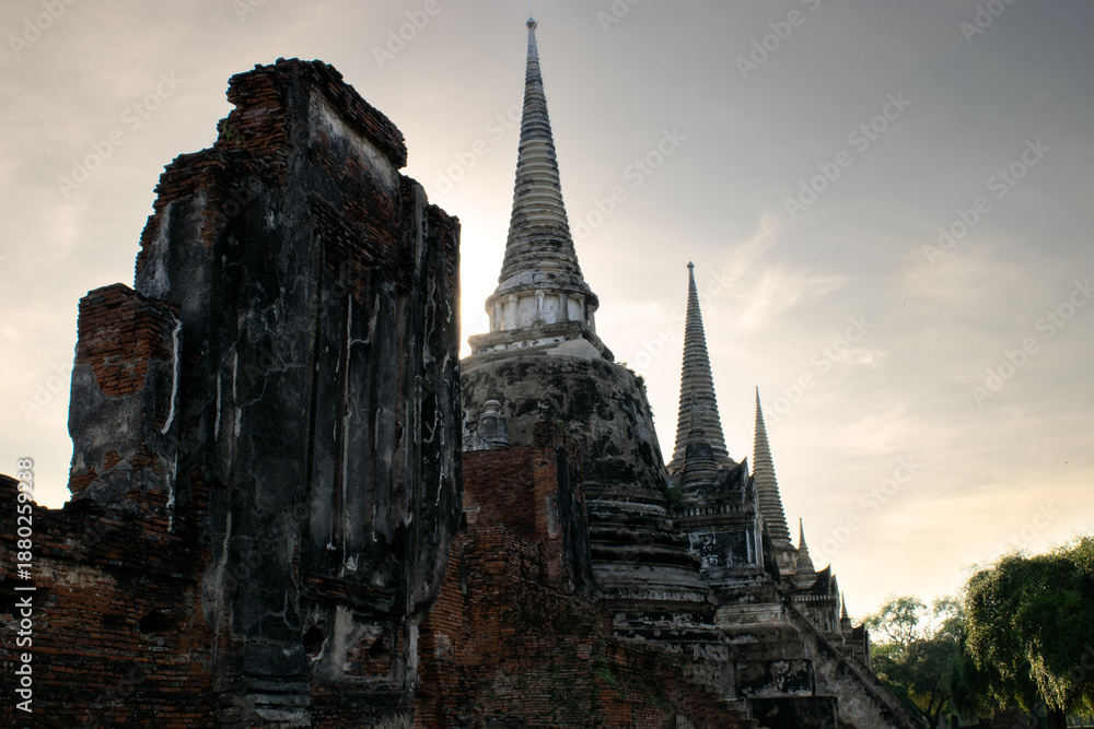 Fototapeta premium Ancient Brick Wall and Three Chedis of Wat Phra Si Sanphet