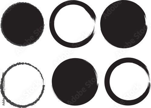 Abstract black ink blots resembling circles and ovals on a white background