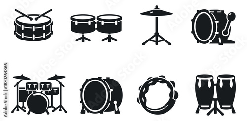 Solid icon percussion instruments set featuring drums, cymbals, tambourine, and a complete drum kit for music and rhythm design