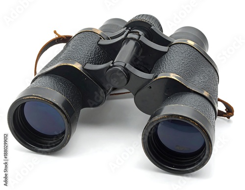 Black vintage binoculars with brown leather strap set on white surface