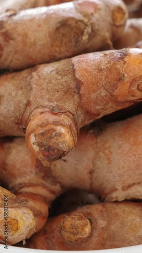 Wallpaper Mural Roots of turmeric in plate on table. Nobody. Vertical footage Torontodigital.ca