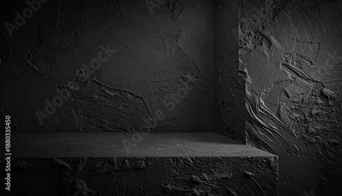 Dark sculpted corner with flowing black textures and wave-like plaster patterns, evoking immersive abstraction.