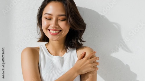 A stunning filipina mestiza woman expresses her beauty with grace, basking in soft light. The simplicity of the moment captures her elegance beautifully, creating an enchanting atmosphere