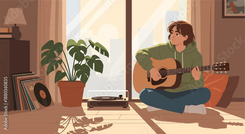 Young musician playing acoustic guitar at home