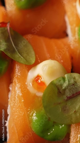 Wallpaper Mural Sushi rolls with salmon rotating, closeup. Japanese cuisine. Vertical footage Torontodigital.ca
