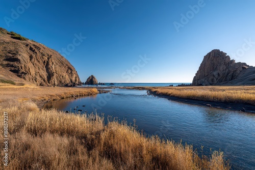 Scenic Coastal Landscape with Rocky Formations and Clear Blue Sky at Calm Waters Under Sunny Day in Oda Japan