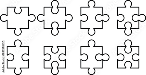 Black and white puzzle pieces with various cutouts