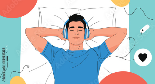 Young man lying in bed with his hands behind head wearing headphones and listening to music for relaxation on light blue background.