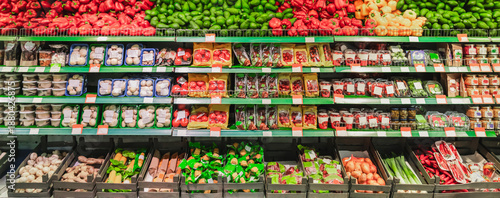 Supermarket showcase of vegetables and fruits. The department of fresh vegetables and fruits in the store, grocery merchandising. High quality photo