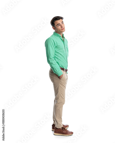 Side view of thoughtful man looking up