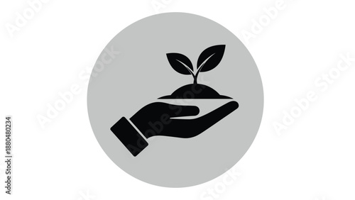 A hand holds a small plant growing from soil within a circle.
