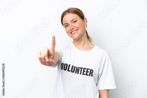 Wallpaper Mural Young volunteer woman isolated on white background showing and lifting a finger Torontodigital.ca