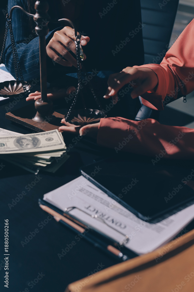 Fototapeta premium Consultation and conference of professional businesswoman and Male lawyers working and discussion having at law firm in office. Concepts of law, Judge gavel with scales of justice