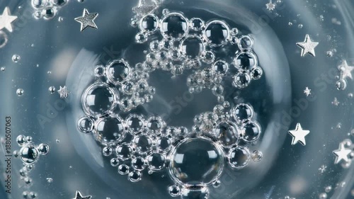 Sparkling silver bubbles and stars swirl.